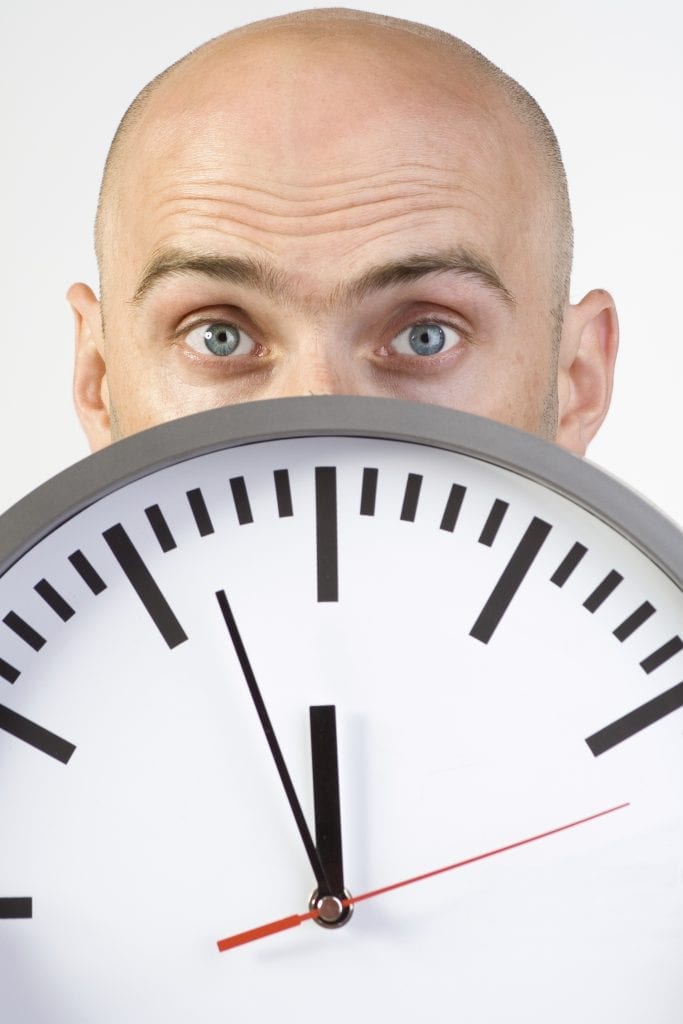 Bald man and clock - iStock_000004094908_Large