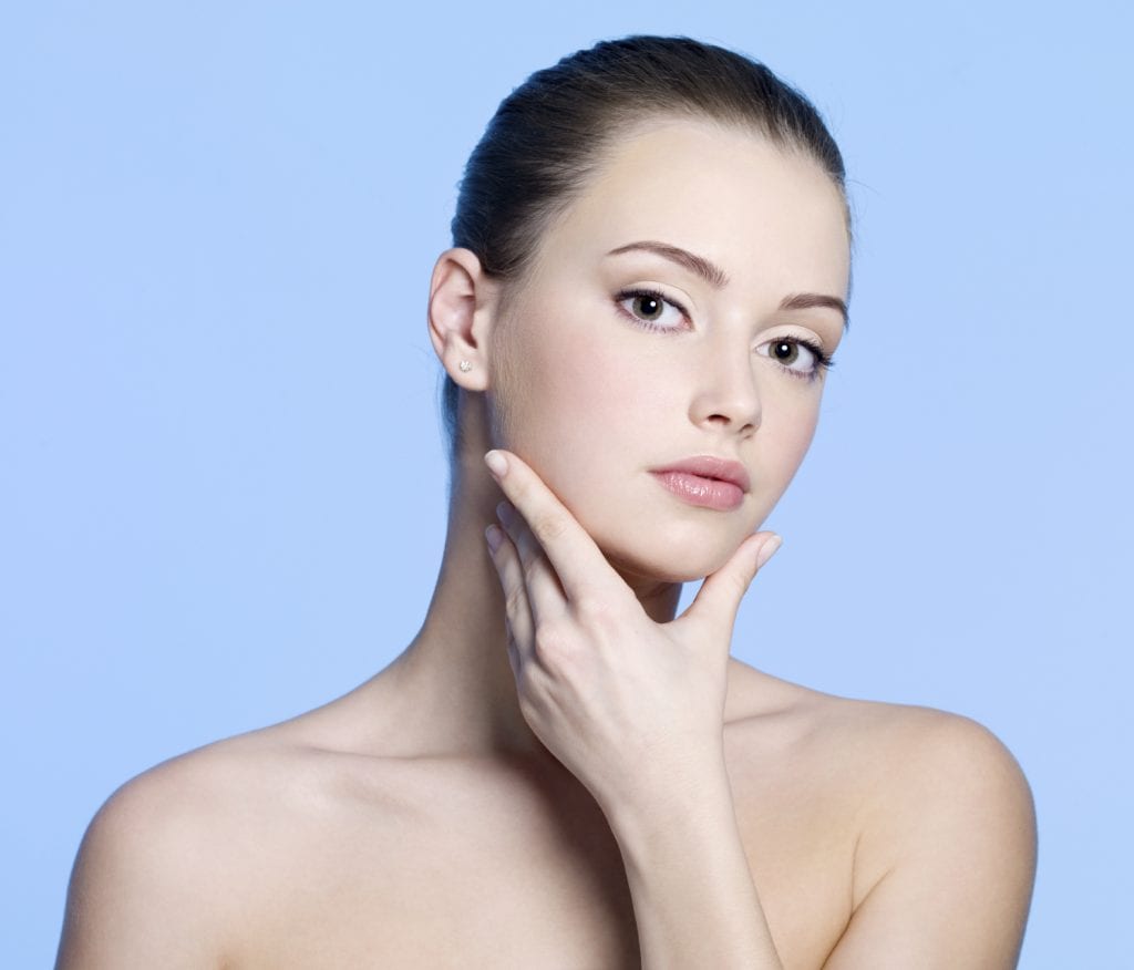 young woman with clean healthy skin on face