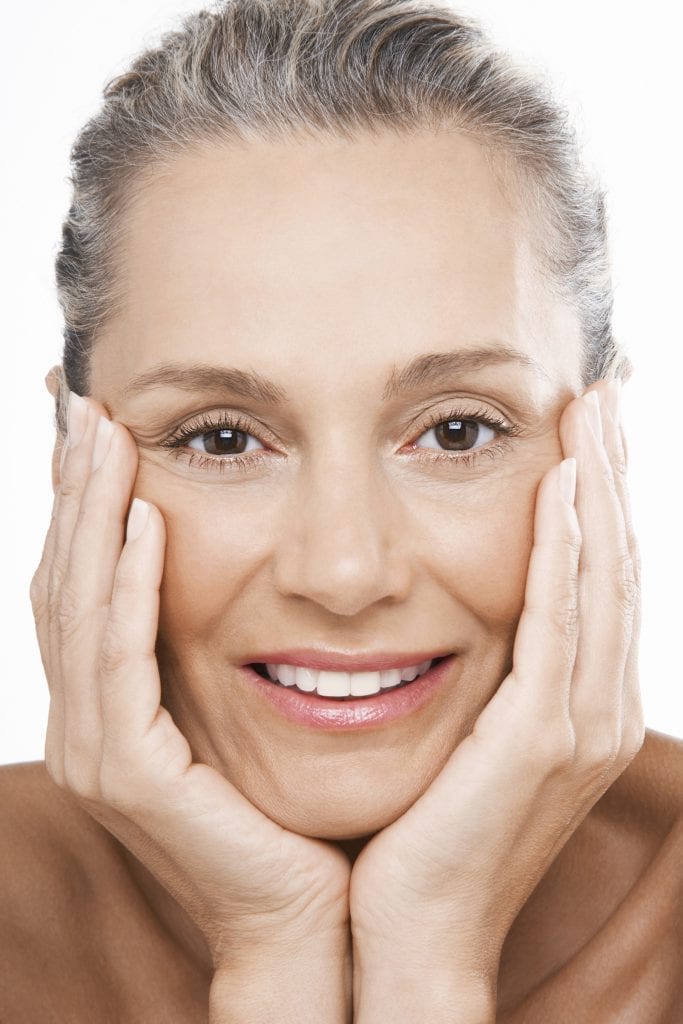 Mature Woman With Hands on Face - iStock_000032794814_Large