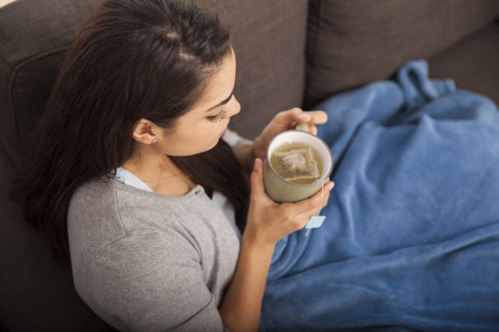 cold girl drinking tea