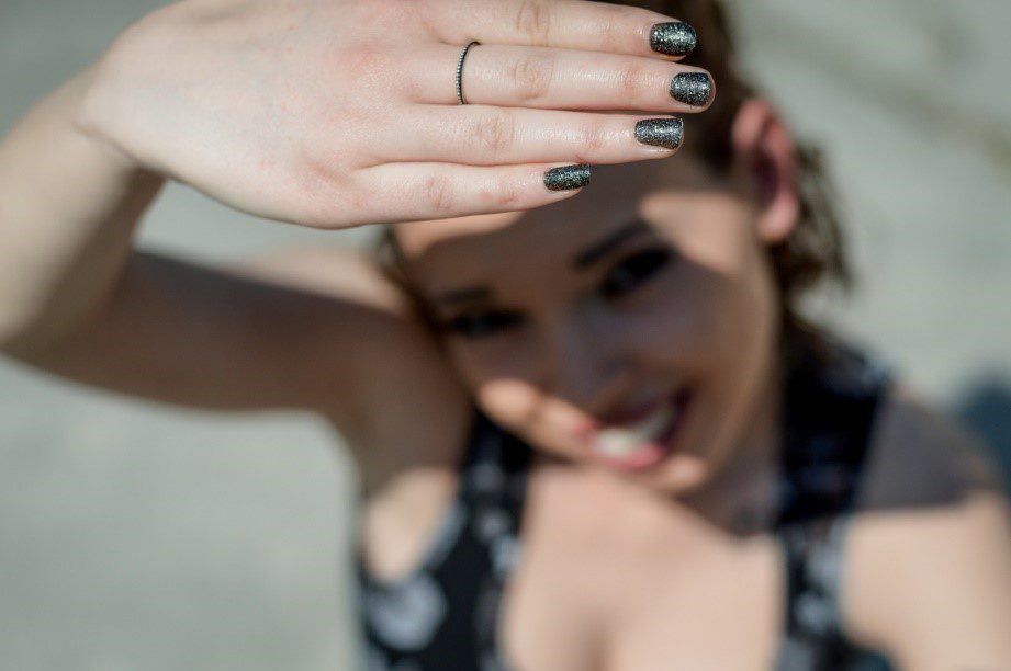 Woman shielding from the sun