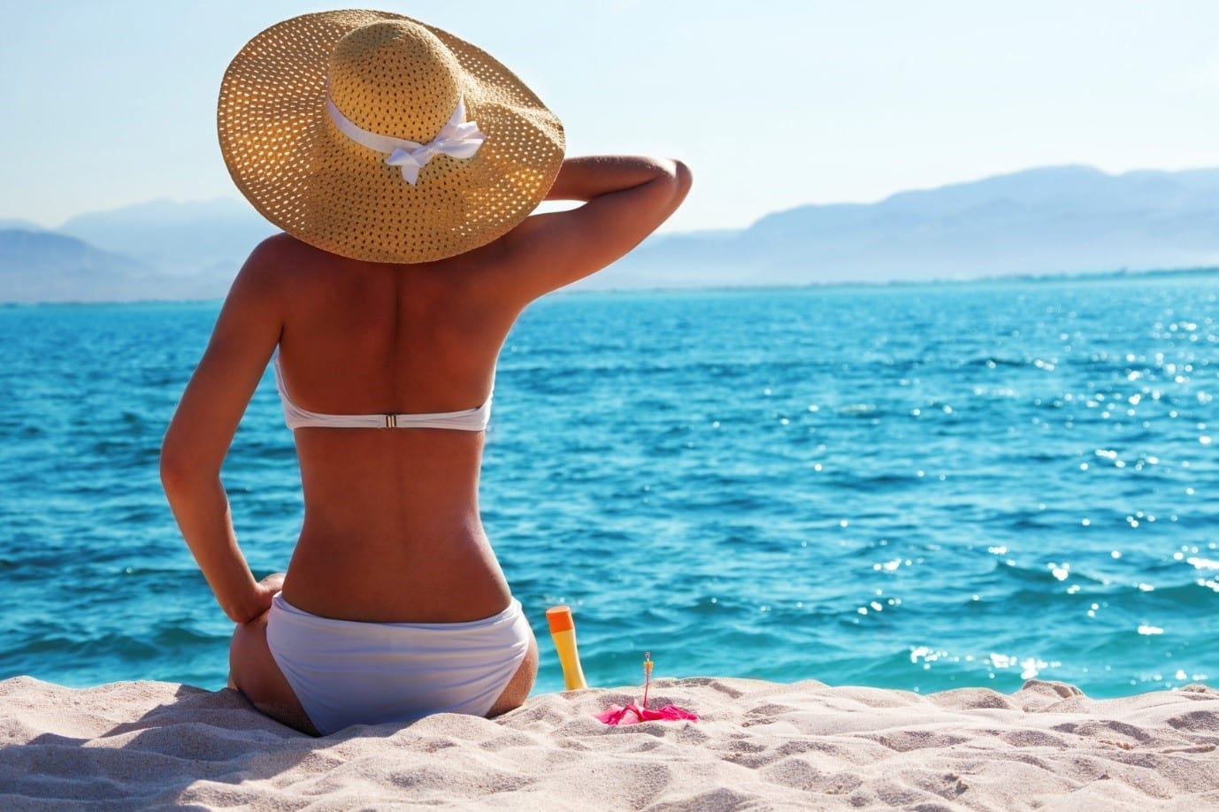 woman sunbathing on the beach