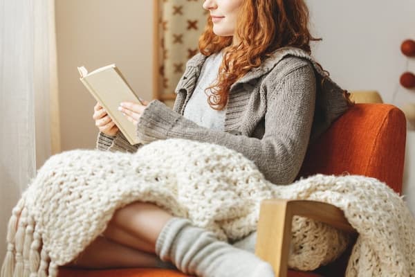 Woman-Reading-in-Bedroom