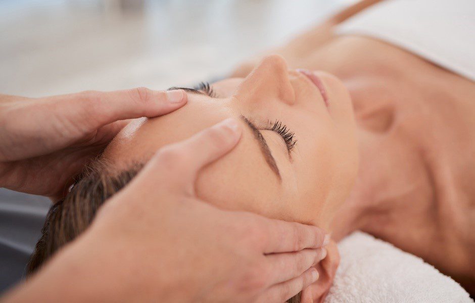 Patient at ASC having a face massage as part of a professional facial