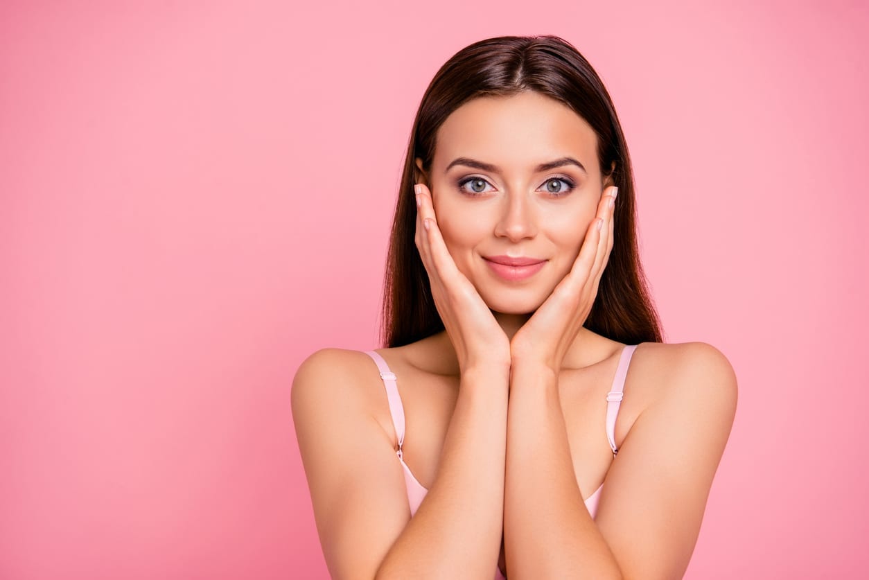 Close up portrait of beautiful cute gentle trying scrub effect touching skin with arms her she young girl wearing pale pink bra isolated on rose background