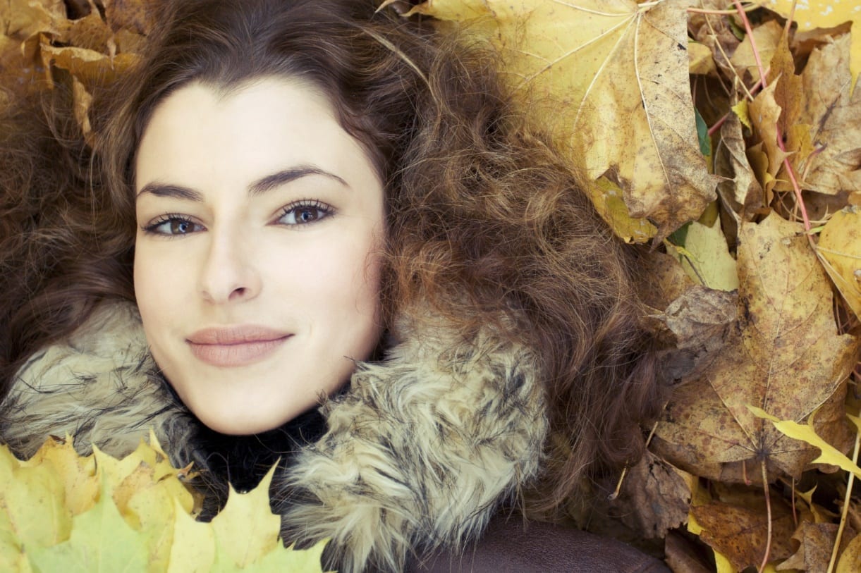 woman with autumn leaves