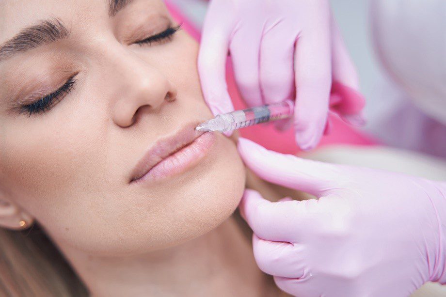 Woman having lip injections