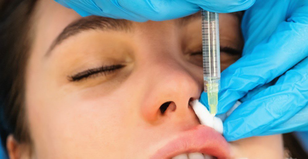 Woman in the process of getting lip injections