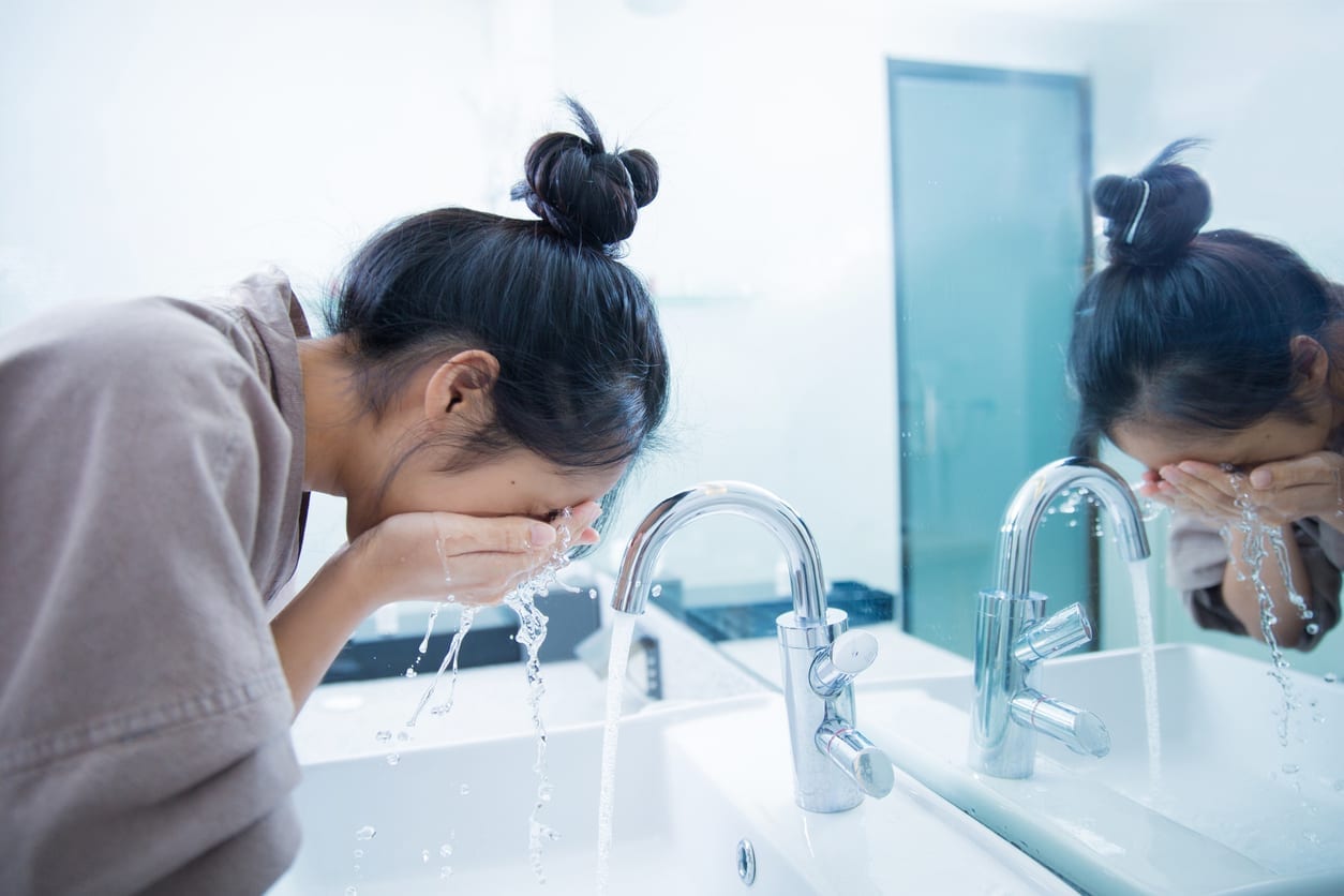 woman washing face