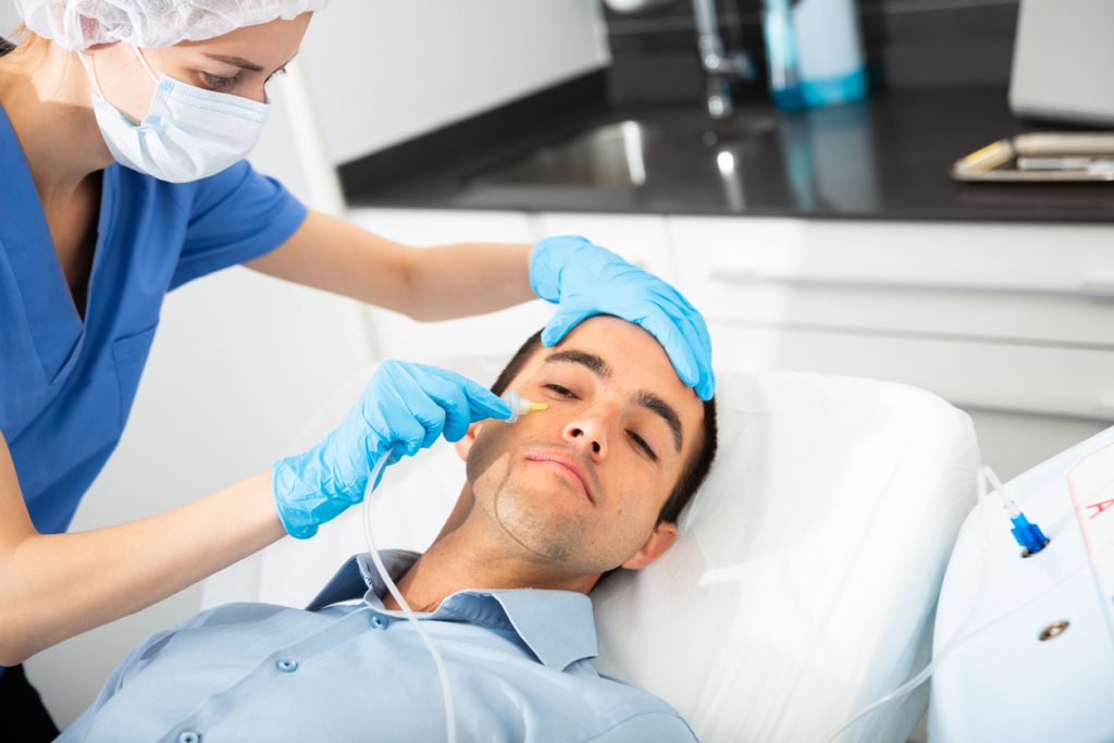 Man having cosmetic treatment