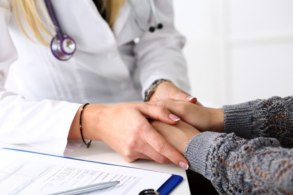 Woman at cosmetic surgeon consultation