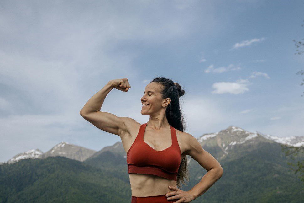 women flexing biceps