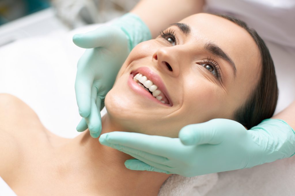 Woman happy after receiving a facial