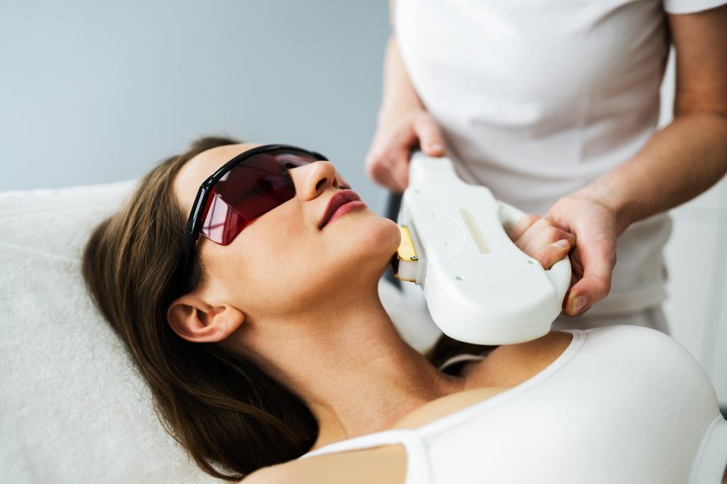 A woman receiving an IPL treatment