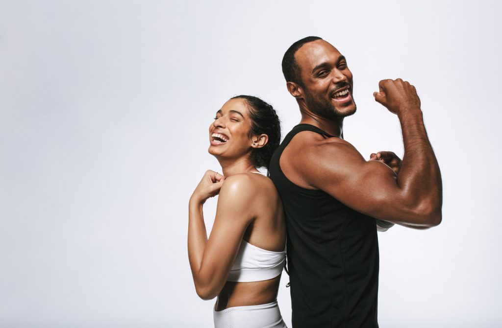 Male and female athletes posing