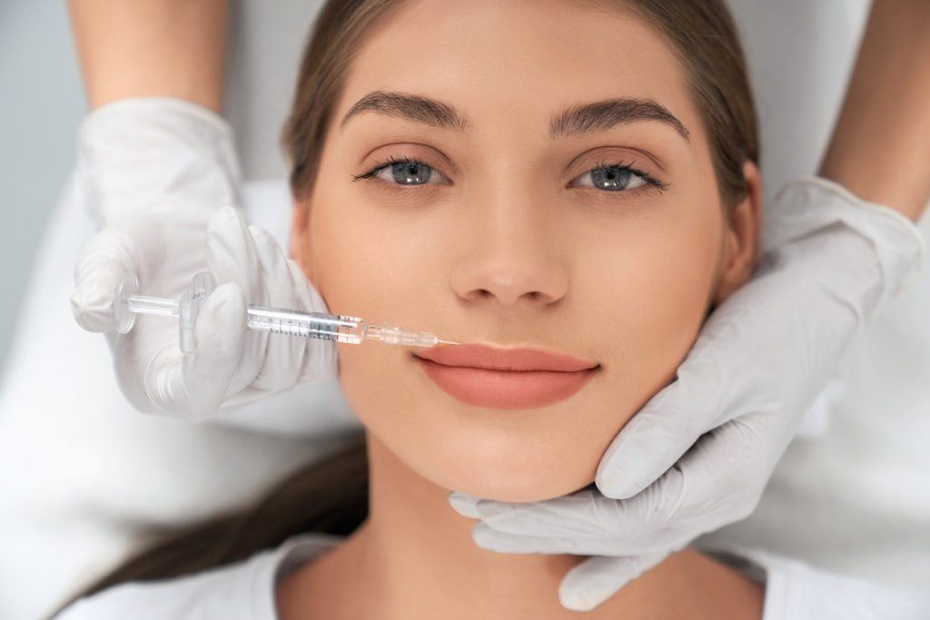 Woman having lip fillers at a reputable skin clinic