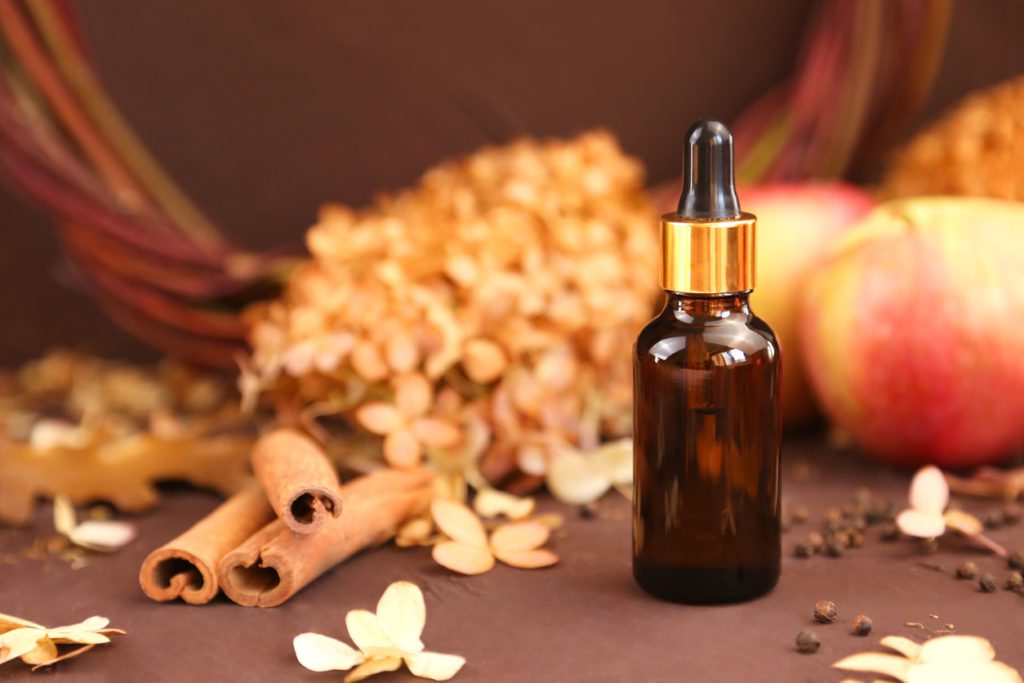 Skincare serum with autumnal background
