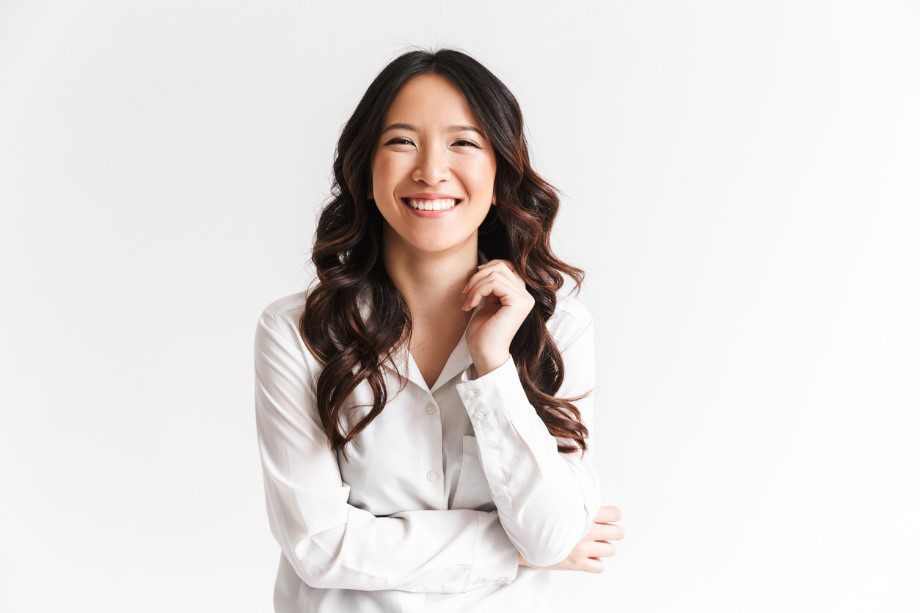 Woman smiling wearing white shirt