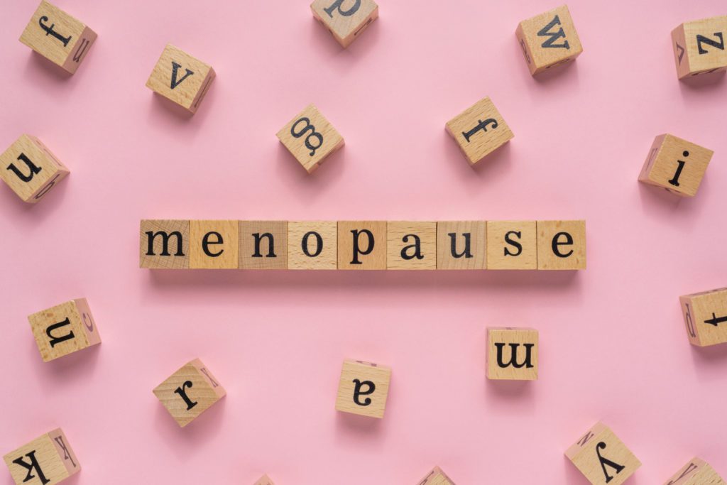 Menopause graphic on pink background