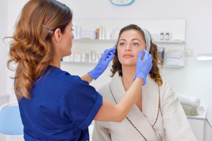 woman having a consultation for facial cosmetic surgery