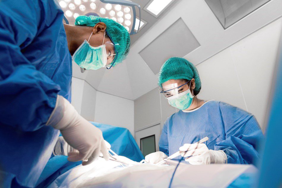 surgeons operating on someone