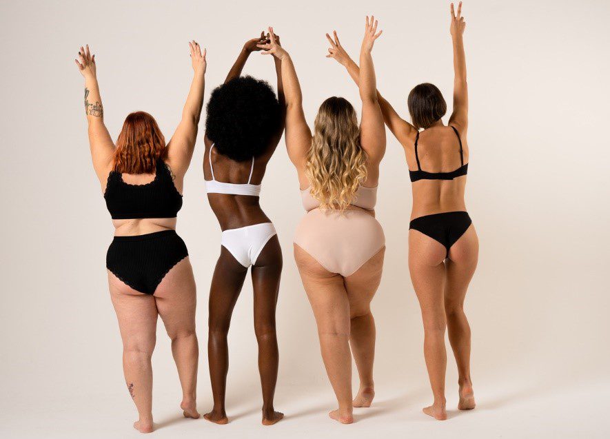 woman with different body shapes facing the back with arms up